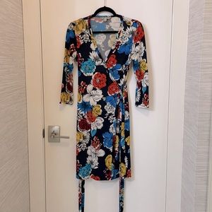 Beautiful floral wrap dress! 3/4 length sleeves. Machine wash. Mint condition.